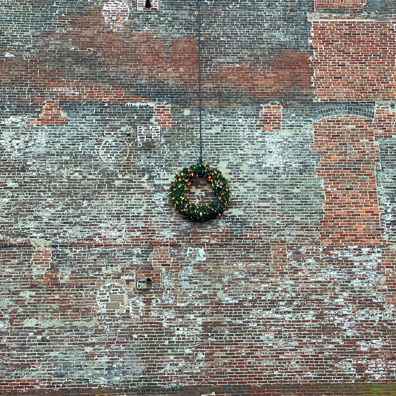 wreath on wall of building